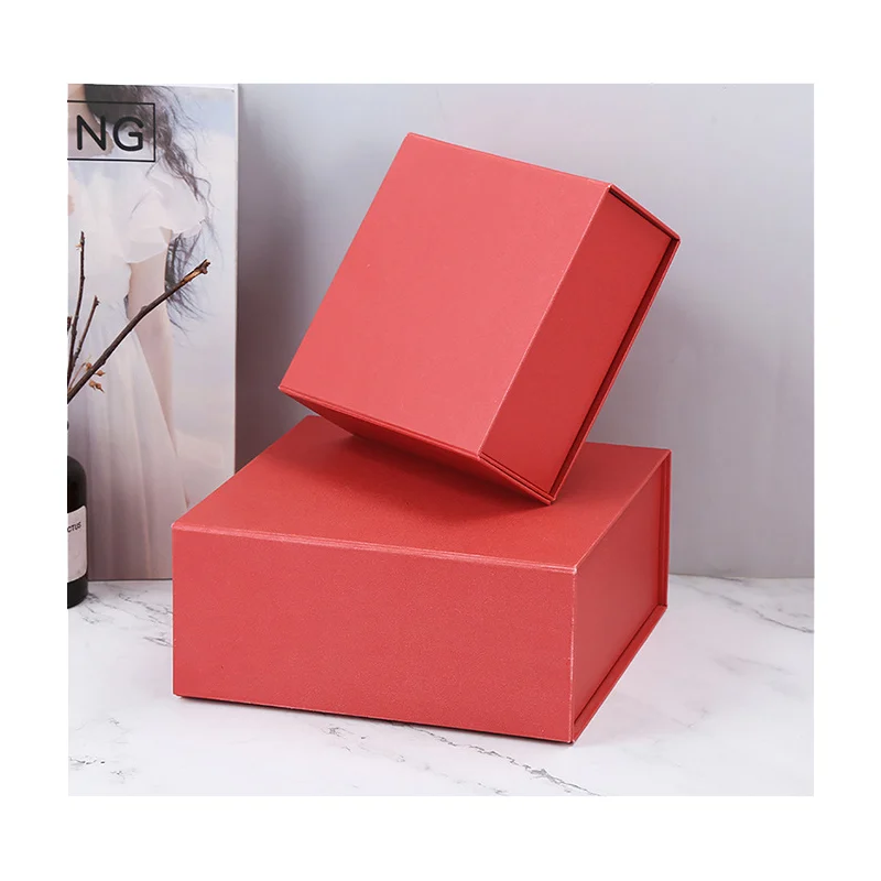 Two red foldable rigid gift box samples shown assembled in different sizes