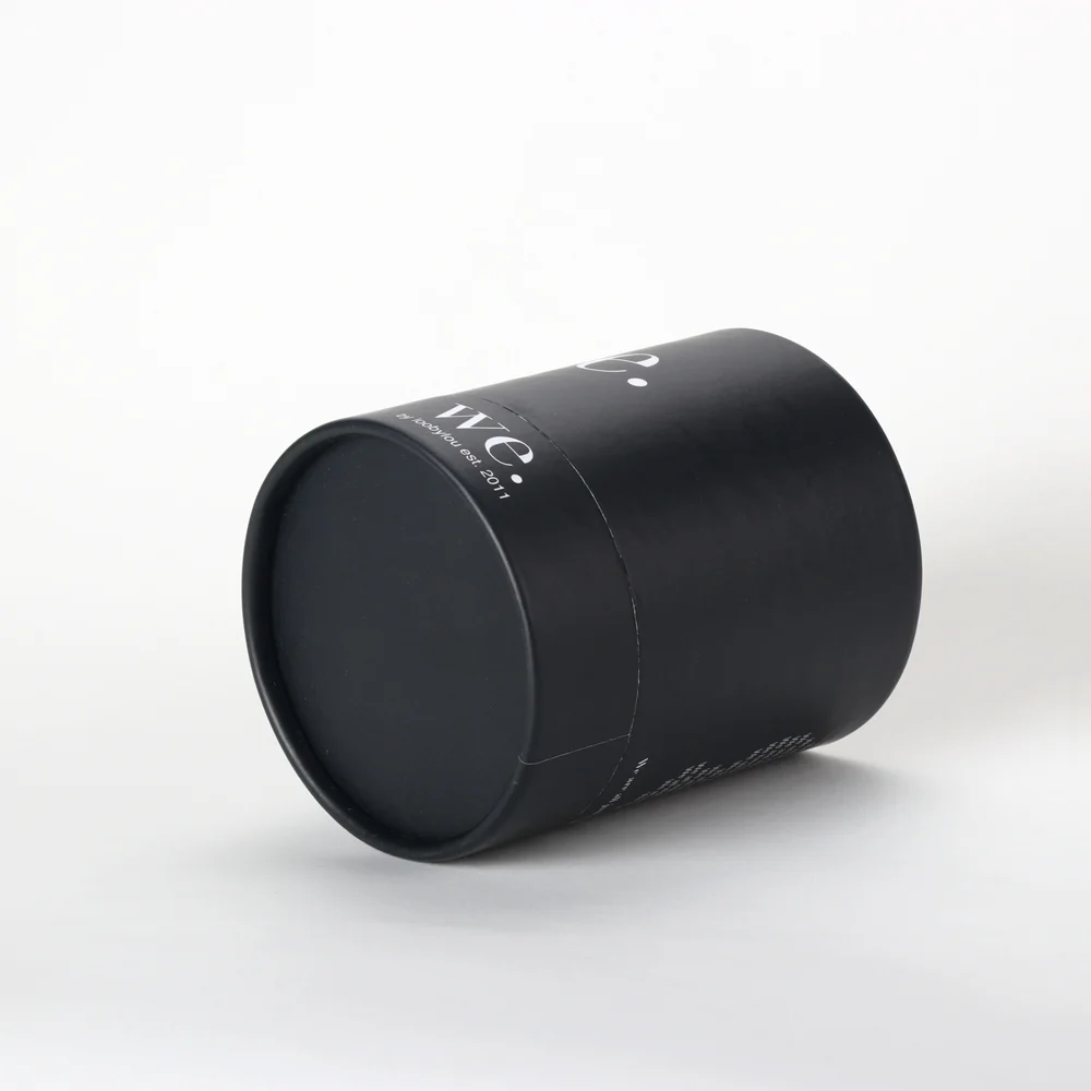 Physical matte black paper tube showing rolled edge and cylindrical seam